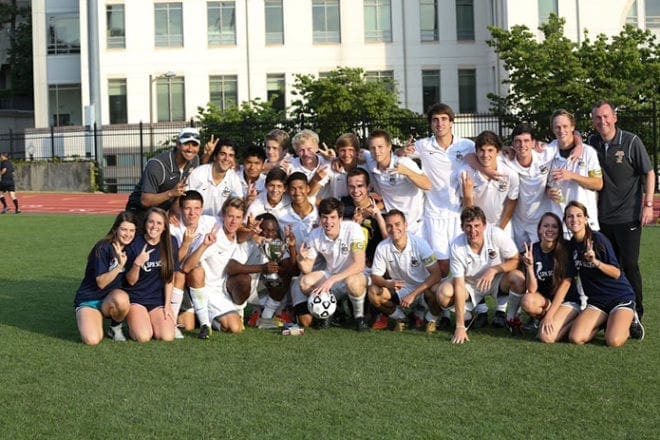 St. Pius X High School head soccer coach David O'Shea, back row far right, and assistant coach Lucas Moreno, back row far left, celebrate the boys team's second state championship in a row.