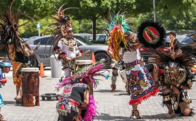 Hispanic dancers perform on the plaza at the Georgia International Convention Center in College Park during the 19th annual Eucharistic Congress. Photo By Thomas Spink