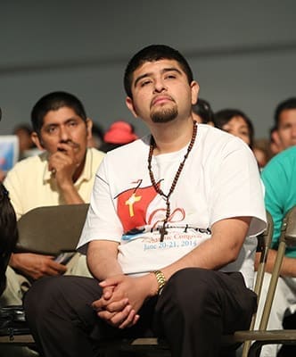 Spanish track attendees listen to an afternoon talk by Father Guillermo Córdoba, pastor of Our Lady of the Americas Church, Lilburn. Photo By Michael Alexander