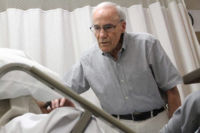 Dr. John Read has volunteered at Our Lady of Perpetual Help Home for nearly 30 years. Every Tuesday and Thursday he stops by to check on all the patients. Dr. Read is a parishioner at St. Thomas More Church, Decatur. Photo By Michael Alexander