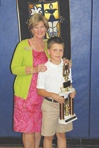 Immaculate Heart of Mary School student Zachary Sutter won a national prize for his penmanship. His handwriting was recognized as the best in the country among second-graders. The award was given by Zaner-Bloser, the language arts and reading company. Standing with him is his teacher, Ruthie Patch, who attended a reading conference, courtesy of the company.  