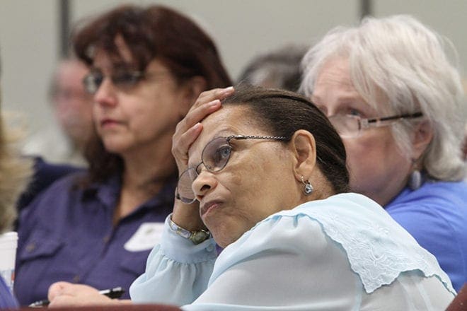 (Clockwise from center) Linda Ryan of St. Paul of the Cross Church, Atlanta, Frances Rentas of St. John Vianney Church, Lithia Springs, and Gail Fredericks of St. Joseph Church, Marietta, hang on every word from John Starbuck, as he shares the story of his stepdaughter’s killing, his opposition to the death penalty and his feelings on restorative justice. Photo By Michael Alexander