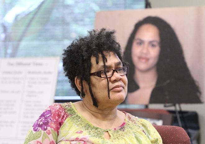 Kimberly Starbuck sits before an image of her late daughter Meleia. In 2005 Meleia, 19, was the victim of a shooting. Starbuck and her husband John travel around the country speaking on forgiveness from the family’s point of view. Photo By Michael Alexander