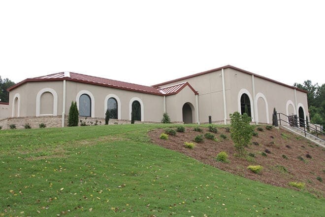 The new 13,000-square-foot parish center at St. Monica Church in Duluth includes St. Augustine Hall, right, and the Mary, Mother of the Eucharist Chapel, left. The parish hall can seat 400 people for events and 250 for banquets. It also has a stage and a built-in dance floor, along with an extremely high tech audio/video/lighting system. The new hall’s kitchen comes equipped with 24 feet of cooking hood space and a very large pantry. Photo By Michael Alexander