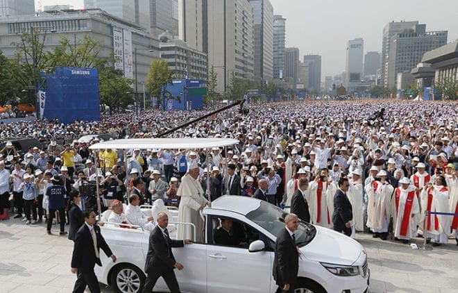 Pope Francis arrives to celebrate the Aug. 16 beatification Mass of Paul Yun Ji-chung and 123 martyred companions in Seoul, South Korea. CNS photo/Paul Haring
