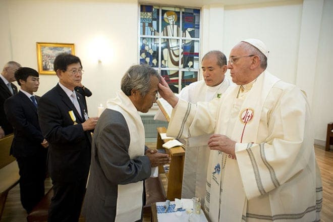 Pope Francis baptizes Lee Hojin, the father of a victim of the April South Korean ferry accident, at the nunciature in Seoul Aug. 17. Lee took the baptismal name Francis in honor of the pope. CNS photo/L'Osservatore Romano, pool