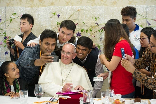 Pope Francis poses for a selfie while eating lunch with youth at the major seminary in Daejeon, South Korea, Aug. 15. CNS photo/L'Osservatore Romano, pool