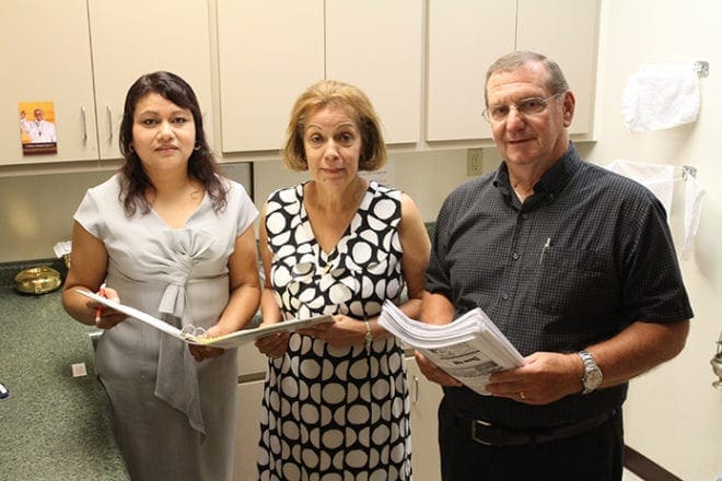 (L-r) Blanca Gonzalez, the director of Hispanic ministry, works closely with Esilda Schuster and her husband Alex, RCIA coordinators for the Spanish- and English-speaking community, respectively. Photo By Michael Alexander