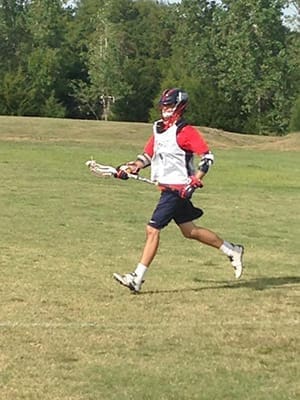 Wearing his practice uniform, Jake Henderson runs across the field at St. Gregory University in Shawnee, Oklahoma, where he earned a scholarship to play lacrosse for the school. Henderson is a 2014 graduate of St. Pius X High School in Atlanta.