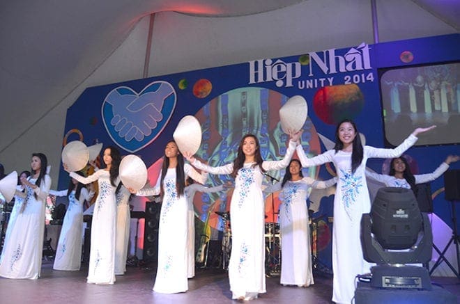 Traditional dancers wow the crowd at the Holy Vietnamese Martyrs Church festival Aug. 29. The festival was first launched in 2009 in part to raise funds for a new church for the growing Catholic Vietnamese community. PHOTO BY CINDY CONNELL PALMER