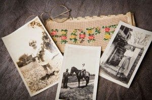 The Emory collection  includes family photographs of Flannery O’Connor, a pair of eyeglasses and a piece of needlework that says “Hope.” Photo By Ann Borden, Emory Photo/Video