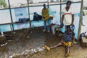 Liberians wait outside the John F. Kennedy Ebola treatment center in Monrovia, Liberia, Sept. 18. CNS photo/Ahmed Jallanzo, EPA