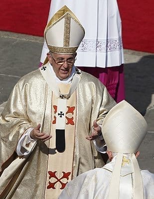 Pope Francis greets retired Pope Benedict XVI at the conclusion of the beatification Mass of Blessed Paul VI in St. Peter's Square at the Vatican Oct. 19. Blessed Paul, who served as pope from 1963-1978, is most remembered for his 1968 encyclical, "Humanae Vitae," which affirmed the church's teaching against artificial contraception. CNS photo/Paul Haring 