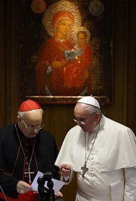 Pope Francis talks with Italian Cardinal Lorenzo Baldisseri, general secretary of the Synod of Bishops, during the morning session on the final day of the extraordinary Synod of Bishops on the family at the Vatican Oct. 18. CNS photo/Paul Haring 