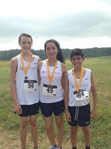 Cristo Rey Atlanta Jesuit High School competed in its first cross country meet on Oct. 25. (L-r) Tyler Wade, girls captain Julia Sanchez and boys captain Anthony Rustrian were the team’s three medalists.
