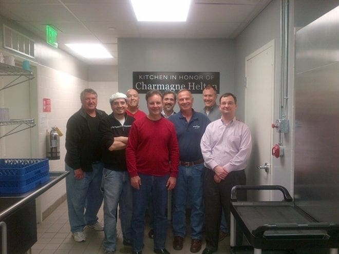 (L-r) Don Hyde, Gabe Orthous, Don Huizer, Chris Surbrook, Scott Burke, Len O'Neill, Jim Quinn and Matt Barrett are some of the men from St. Brigid Church, Johns Creek, who occasionally volunteer at the Gwinnett County Partnership Against Domestic Violence shelter where they cook meals for the women and children.