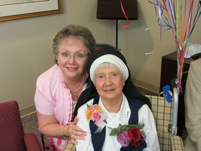 Mercy Sister Mary Kristen Lancaster is pictured at a retirement party for her in August at St. Joseph’s Hospital in Savannah where she had worked since 1980. Mary Alice Smiley, left, was one of her nursing students at Saint Joseph’s Infirmary in Atlanta and then worked with her in Savannah.