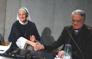 Sister Agnes Mary Donovan, coordinator of the Council of Major Superiors of Women Religious, shakes hands with Jesuit Father Federico Lombardi, the Vatican spokesman, at the conclusion of a Dec. 16 Vatican press conference for release of the final report of a Vatican-ordered investigation of U.S. communities of women religious. The 5,000 word report summarizes problems and challenges the women see in their communities and thanks them for their service. The visitation was carried out between 2009 and 2012. CNS photo/Paul Haring
