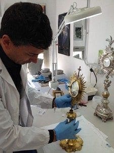 A Vatican Museums restorer works in the laboratory on a Baroque period monstrance. The new Georgia chapter of the Patrons of the Arts of the Vatican Museums funded the restoration of two monstrances and a censer, dating to the late 1700s.