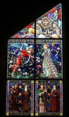 The new stained glass window at Our Lady of the Mountains Church in Jasper is the work of Joe Beyer and his studio in Philadelphia. Installed on Dec. 17, 2014, this is one of two tall windows called “The Magnificat Windows” that appear on each side of the church’s altar. Photo By Michael Alexander