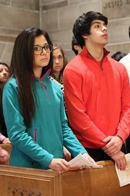 Jasmine Rostro, left, of North Forsyth High School, and Dennis Tovar, of Forsyth Central High School, attend the Jan. 22 Mass for the Unborn. The Catholic, public school sophomore students attended the Mass with their youth minister from Good Shepherd Church in Cumming. Photo By Michael Alexander