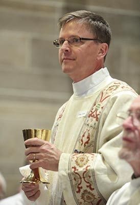 Deacon John Timme decided to follow in the footsteps of his late father, Deacon Bill. Twenty-eight years earlier John saw his father’s ordination and he carried the memories of that day with him during his own ordination, Feb. 7. Photo By Michael Alexander