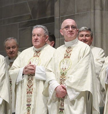 Several Irish-born priests were on hand for the St. Patrick’s Day Mass, including (front row, l-r) senior priest Msgr. James Fennessy and Cathedral of Christ the King rector Msgr. Francis McNamee and (back row, r) Msgr. John Walsh, pastor of St. Joseph Church, Marietta. The Hibernian Benevolent Society of Atlanta sponsors the annual Mass. Photo By Michael Alexander