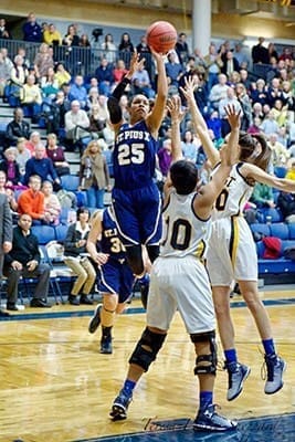 Asia Durr (#25) hits the game-winning shot versus Marist School Jan. 6. The St. Pius X senior, who will play for the University of Louisville in the fall, finished her career at the high school as the leading scorer, male or female, in school history. Photo By Teresa Penley Sheppard
