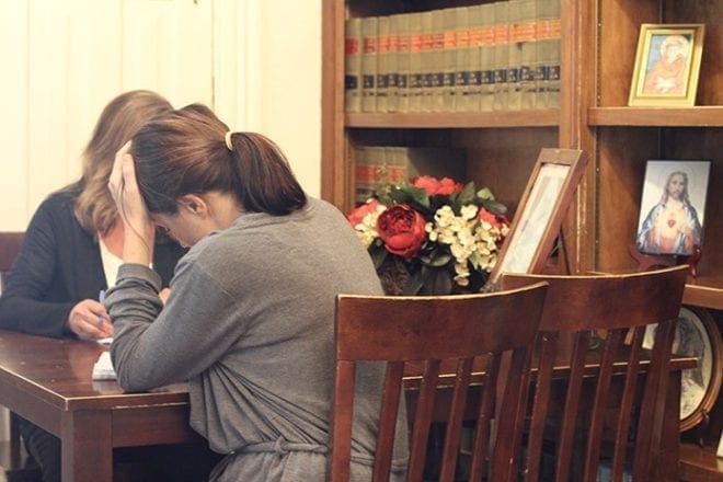Two residents prepare for the afternoon group session at GraceWay Recovery Residence for Women in Albany March 10. GraceWay, founded by a Catholic couple in 2003, can house up to 15 women “seeking long-term sobriety in an intense recovery program.” 