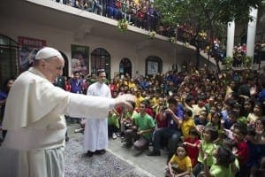 Pope Francis waves to young people at a home for former street children in Manila, Philippines, Jan. 16. CNS photo/L'Osservatore Romano via Reuters