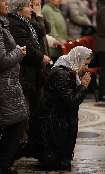 People pray during a Divine Liturgy celebrated by Archbishop Sviatoslav Shevchuk of Kiev-Halych, leader of the Ukrainian Catholic Church, for Ukrainian expatriates at the Basilica of St. Mary Major in Rome Feb. 19. CNS photo/Paul Haring