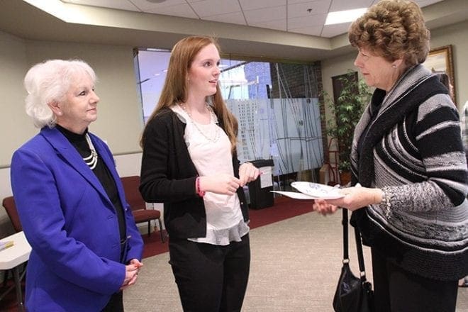 Cheryl FitzGerald, right, the coordinator of special needs religious education at St. Thomas the Apostle Church, Smyrna, speaks with Susan Dorner, left, chairman of the Disability Advisory Council for the Archdiocese of Atlanta, and Annie Dempsey, center, the state director of the Georgia Miss Amazing Pageant, a pageant for girls and women with disabilities. 