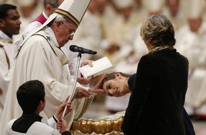 Pope Francis baptizes Giulia Riccardi from Italy during the Easter Vigil in St. Peter's Basilica at the Vatican April 4. CNS photo/Paul Haring
