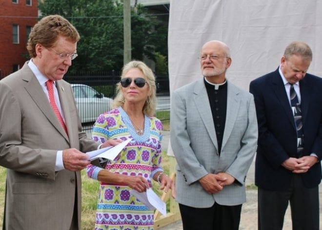 On May 12, the Mercy Care staff joined Bishop Luis R. Zarama at the new site of the future Mercy Care Chamblee clinic for a blessing of the site. Gathered in a circle, the group listened to Scripture passages read by Dave Fitzgerald, left, and Jane Haverty, second from left, co-chairs of the Mercy Care capital campaign. Also shown are Father Steve Yander, second from right, and Dave Spotanski, chief operating officer of the Atlanta Archdiocese.