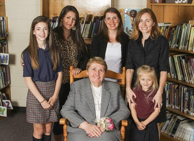 Grey Nun of the Sacred Heart Sister Dawn Gear, sitting, is joined for a photograph with (l-r) seventh-grader Michaela Adams, her mother Mary Katherine (Turtle) Adams, Emily Marder McCormack, the school’s liturgical music director, Tara Delaney-Smith and her daughter Delaney, a kindergartener. Mary Katherine, Emily and Tara attended St. John Neumann Regional School when Sister Dawn was the principal. Today Mary Katherine and Tara serve on the school’s development committee. Mary Katherine is also on the School Advisory Board. Photo By Michael Alexander