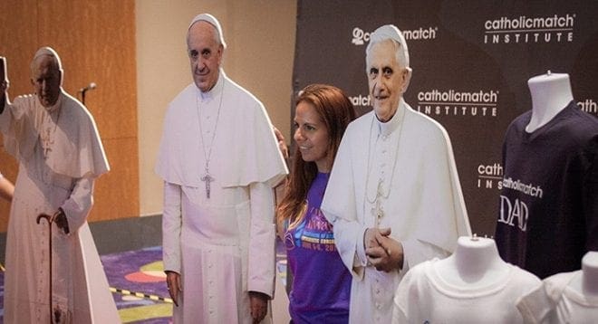 In the exhibitors hall at the congress, one of the most popular sites offered life-size cutouts of Pope Francis, Pope Benedict and St. John Paul II, where people posed eagerly alongside the images of the pontiffs for photos. Photo By Thomas Spink