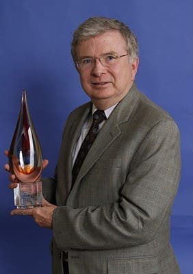 Frank Mulcahy, executive director of the Georgia Catholic Conference, holds the CLINIC Champion award that was presented to him by the Catholic Legal Immigration Network, Inc. during the organization’s 2015 convention in Salt Lake City, Utah. Photo By Michael Alexander