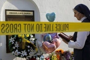 Sister Mary Thecla of the Daughters of St. Paul prays outside the Emanuel African Methodist Episcopal Church in Charleston, S.C. June 19. CNS photo/Brian Snyder, Reuters 