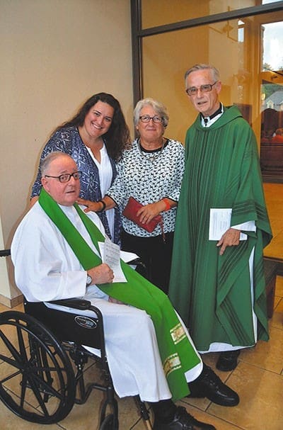Father Richard Kieran celebrated his 50th anniversary of ordination to the priesthood at a June 20 Mass at Immaculate Heart of Mary Church in Atlanta. Helping him mark the jubilee were, l-r, niece Rachel, sister-in-law Rosemary, and brother, Father John Kieran. Rosemary is the wife of the Kierans’ late brother, Eugene. Photo By Cindy Connell Palmer