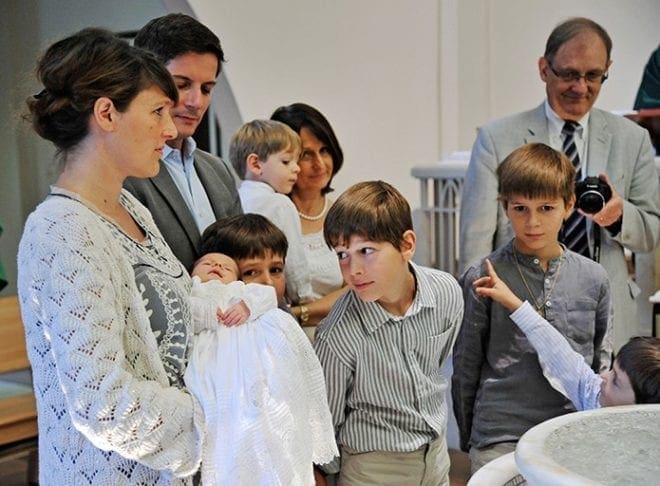 The Mass included the baptism of Mariska, the sixth child in the Boutrolle family. She joins five brothers and her parents, who recently joined the ecumenical Faith and Light community and moved to Georgia from France. Photo by Lee Depkin