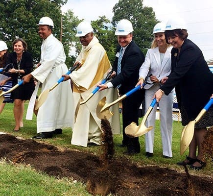 Archdiocesan leaders joined with school, civic and business representatives to begin the construction of the new building project at St. John the Evangelist School, Hapeville, on Thursday, Aug. 27. Breaking ground are, from left, principal Karen Vogtner; Father Michael Onyekuru, pastor of St. John the Evangelist Church; Archbishop Wilton D. Gregory; Justin and Tracy Bevington, campaign co-chairs; and archdiocesan school superintendent Diane Starkovich. Photo By Andrew Nelson
