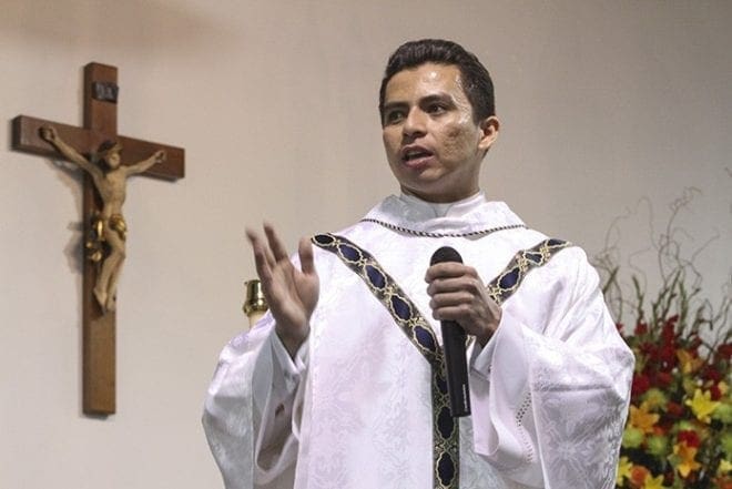 Father Feiser Muñoz, parochial vicar at the Cathedral of Christ the King, shares some closing remarks. Father Muñoz had a major role in helping to bring the mission to its new location off Buford Highway behind Northeast Plaza. Photo By Michael Alexander