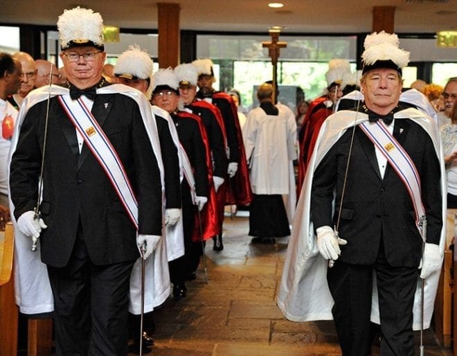 The Knights of Columbus provide an honor guard for the procession at the start of the Sept. 12 Mass commemorating the parish’s 50th anniversary. Photo By Lee Depkin