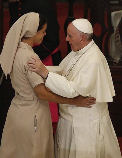 Pope Francis embraces a nun during vespers with priests, religious and seminarians at the cathedral in Havana Sept. 20. CNS Photo/Paul Haring