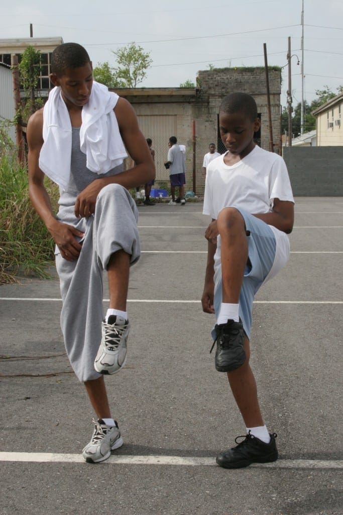 Senior mellophone player Reginald Alexander, left, works with first year marching band member Jeremy Slack during practice. (Page 11, August 24, 2006 issue)