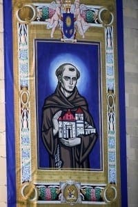 A tapestry featuring an image of Blessed Junipero Serra hangs outside the Basilica of the National Shrine of the Immaculate Conception before Pope Francis arrives for Mass and the canonization of the Spanish missionary Sept. 23 in Washington. CNS Photo/Bob Roller