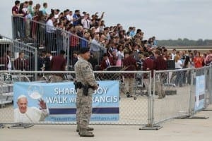 People await the arrival of Pope Francis on the airfield at Joint Base Andrews in Maryland Sept. 22.