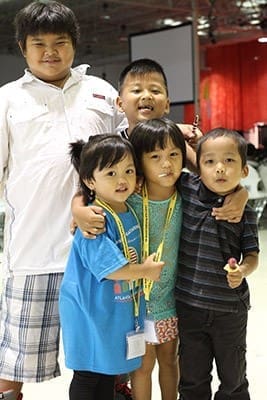 (Clockwise, from top left) Seven-year-old Albert Naing, six-year-old Benedict Kukte, four-year-olds Thang Thang and Shing Sein and three-year-old Angela Mkhumdui were some of the young participants on hand for the National Conference of Burmese Catholics last month. Photo By Michael Alexander