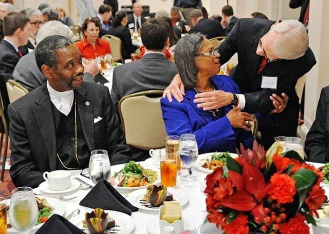At the awards luncheon, Charleston, S.C., Mayor Joseph Riley embraces Marie Goff, wife of the Rev. Dr. Norvel Goff Sr., interim pastor of Emanuel A.M.E. Church in Charleston. Photo By Lee Depkin