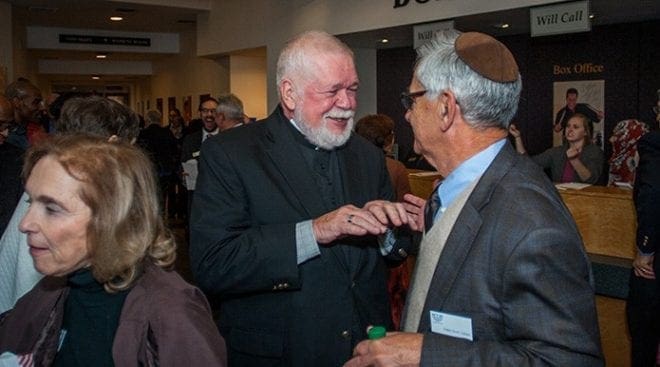 Msgr. Henry Gracz, pastor of the Shrine of the Immaculate Conception, Atlanta, left, converses with Rabbi Scott E. Colbert, senior rabbi of Temple Emanu-El, Atlanta, at the reception before the Nostra Aetate Jubilee celebration Oct. 28. The reception included an art and history exhibition. Rabbi Colbert was a co-chair of the event, and Msgr. Gracz served on the steering committee. Photo By Thomas Spink